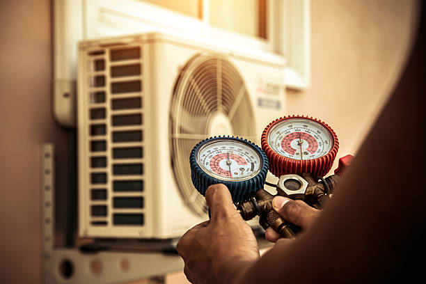 Professional Air Conditioning Service technician working in Sedalia, KY